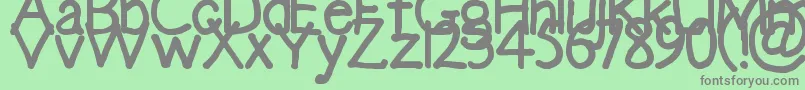 フォントEmma – 緑の背景に灰色の文字