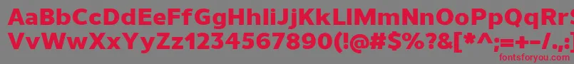 フォントUnimanHeavy – 赤い文字の灰色の背景
