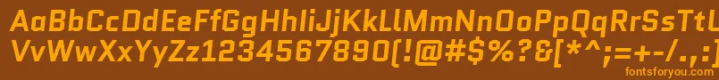 QuanticoBolditalic-fontti – oranssit fontit ruskealla taustalla