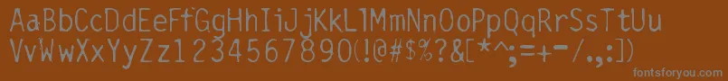 フォントBurnedGothic – 茶色の背景に灰色の文字