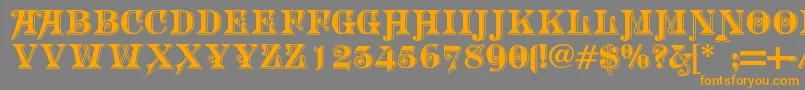 フォントMorgantwentynine – オレンジの文字は灰色の背景にあります。