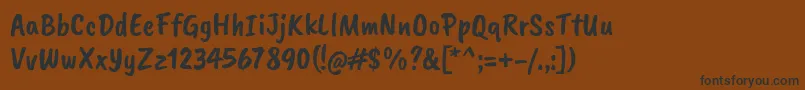 Fonte CaveatbrushRegular – fontes pretas em um fundo marrom
