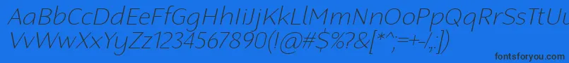 RobagaRoundedThinItalic Font – Black Fonts on Blue Background