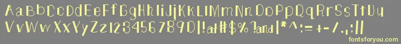 TheUnknownSide-Schriftart – Gelbe Schriften auf grauem Hintergrund