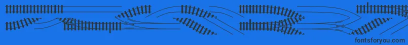 フォントTraintracks – 黒い文字の青い背景