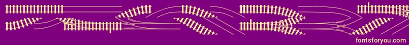 Traintracks Font – Yellow Fonts on Purple Background