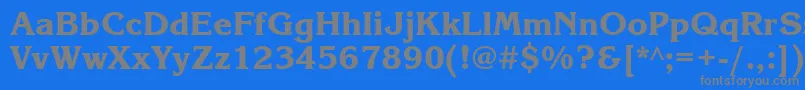 フォントKorinnablackttt – 青い背景に灰色の文字