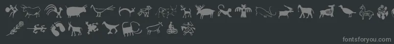 Cavepaintingdingbats-Schriftart – Graue Schriften auf schwarzem Hintergrund