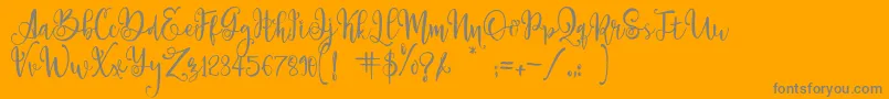 ParadisoVintageDemo-Schriftart – Graue Schriften auf orangefarbenem Hintergrund