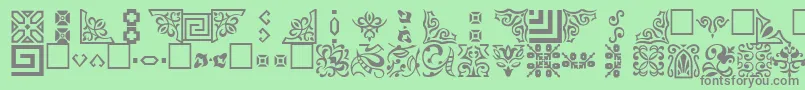 OrnamentttRegular-Schriftart – Graue Schriften auf grünem Hintergrund