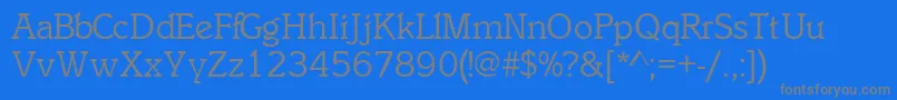 フォントInclinatsskRegular – 青い背景に灰色の文字