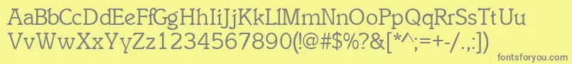 InclinatsskRegular-fontti – harmaat kirjasimet keltaisella taustalla