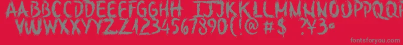 SketchOutYourFingersDemo-Schriftart – Graue Schriften auf rotem Hintergrund