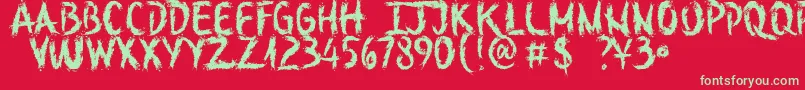 SketchOutYourFingersDemo-Schriftart – Grüne Schriften auf rotem Hintergrund