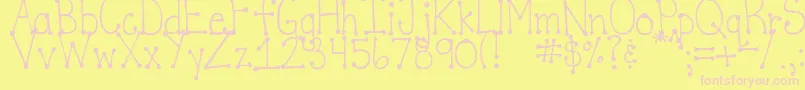 DjbItsFullOfDotsStraight-fontti – vaaleanpunaiset fontit keltaisella taustalla