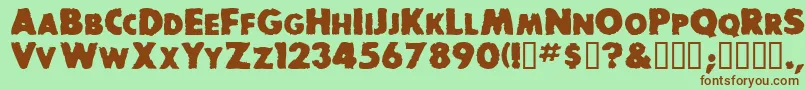 BaddogscapssskBold Font – Brown Fonts on Green Background