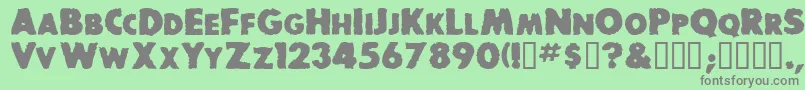 BaddogscapssskBold Font – Gray Fonts on Green Background