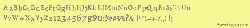 フォントStupid – 黄色の背景に灰色の文字