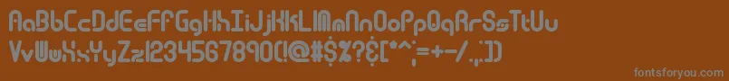 Techover-fontti – harmaat kirjasimet ruskealla taustalla