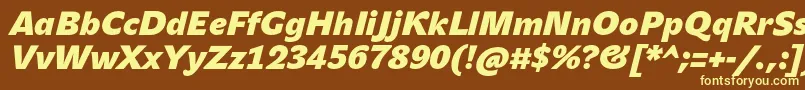 JohnsansHeavyProBoldItalic-fontti – keltaiset fontit ruskealla taustalla