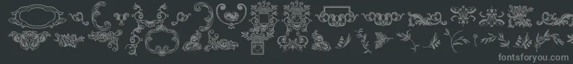 Dingleberries-fontti – harmaat kirjasimet mustalla taustalla