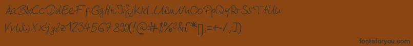 Moderngermanhandwriting Font – Black Fonts on Brown Background
