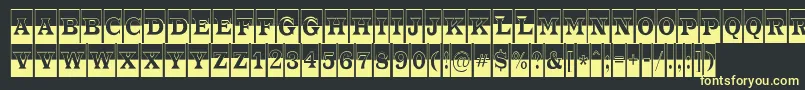 フォントATrianglercmbw – 黒い背景に黄色の文字
