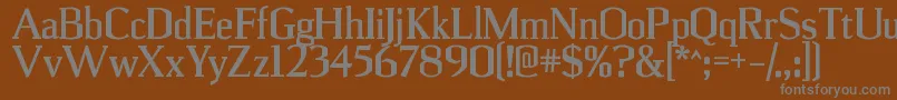UlianrgBold-fontti – harmaat kirjasimet ruskealla taustalla