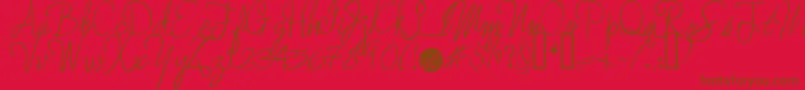 Moreenchanted Font – Brown Fonts on Red Background