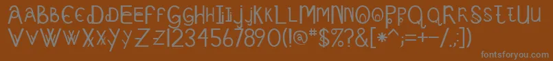 Schizcase Font – Gray Fonts on Brown Background