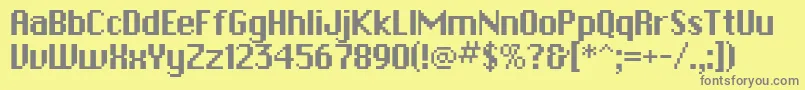 フォントPfbitmapOnesquare – 黄色の背景に灰色の文字