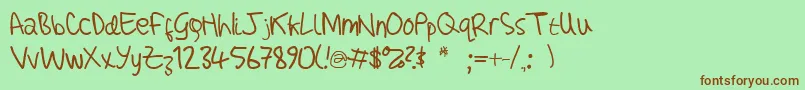 Czcionka AdamHandwritingTest – brązowe czcionki na zielonym tle