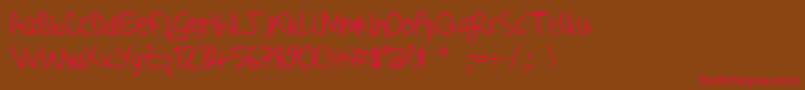 AdamHandwritingTest Font – Red Fonts on Brown Background