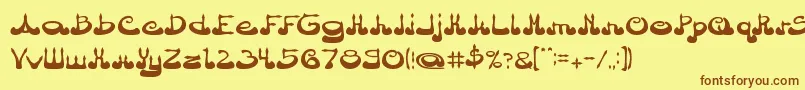 フォントArabianPrince – 茶色の文字が黄色の背景にあります。