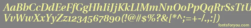 UtopiaSemiboldItalicWithOldstyleFigures-fontti – keltaiset fontit harmaalla taustalla