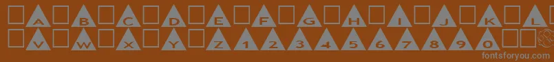 AlphashapesTriangles-fontti – harmaat kirjasimet ruskealla taustalla