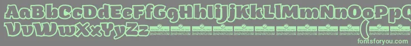ArturoHeavyOutlineTrial Font – Green Fonts on Gray Background