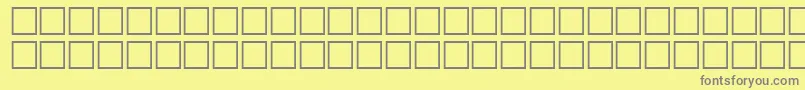 NietzscheRegular-fontti – harmaat kirjasimet keltaisella taustalla