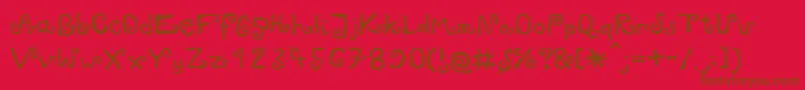 Zawijasy-fontti – ruskeat fontit punaisella taustalla