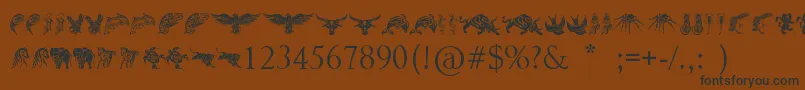 Czcionka TribalAnimalsTattooDesigns – czarne czcionki na brązowym tle