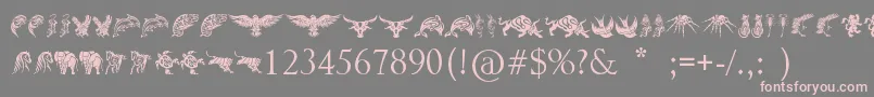 Czcionka TribalAnimalsTattooDesigns – różowe czcionki na szarym tle