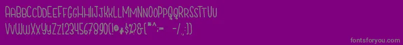 フォントCutiescapsFree – 紫の背景に灰色の文字