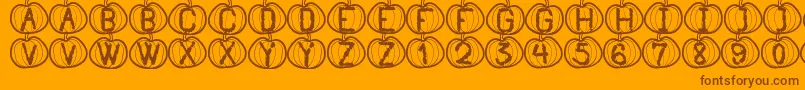 Czcionka PumpkinHalloweenSt – brązowe czcionki na pomarańczowym tle