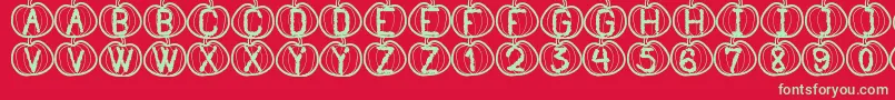 Fonte PumpkinHalloweenSt – fontes verdes em um fundo vermelho