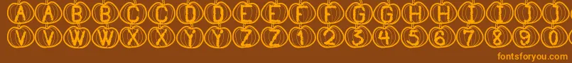 Czcionka PumpkinHalloweenSt – pomarańczowe czcionki na brązowym tle