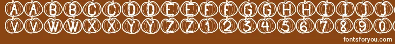 フォントPumpkinHalloweenSt – 茶色の背景に白い文字