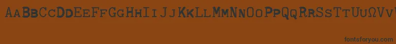 Fonte CmTypewritercapsRegular – fontes pretas em um fundo marrom
