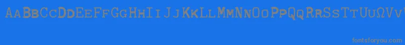 CmTypewritercapsRegular-Schriftart – Graue Schriften auf blauem Hintergrund