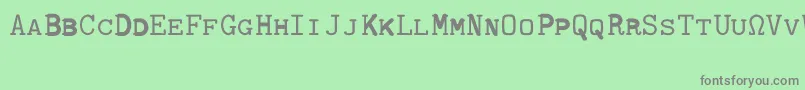 Шрифт CmTypewritercapsRegular – серые шрифты на зелёном фоне