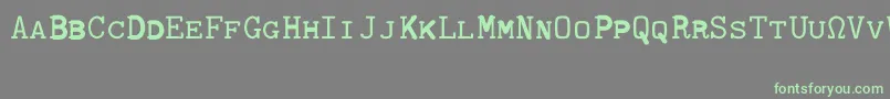 Fonte CmTypewritercapsRegular – fontes verdes em um fundo cinza